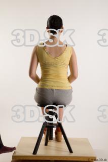 Sitting reference of whole body yellow t shirt gray shorts…